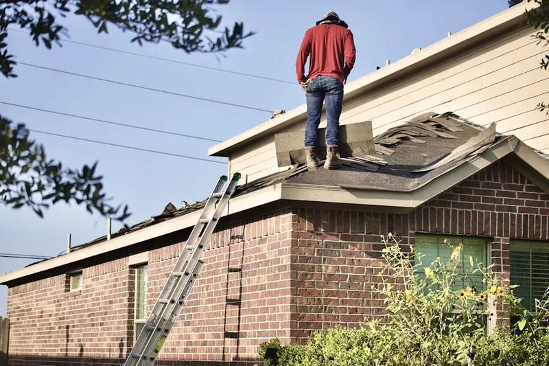 Professional roofer working on a residential roof in Hanover